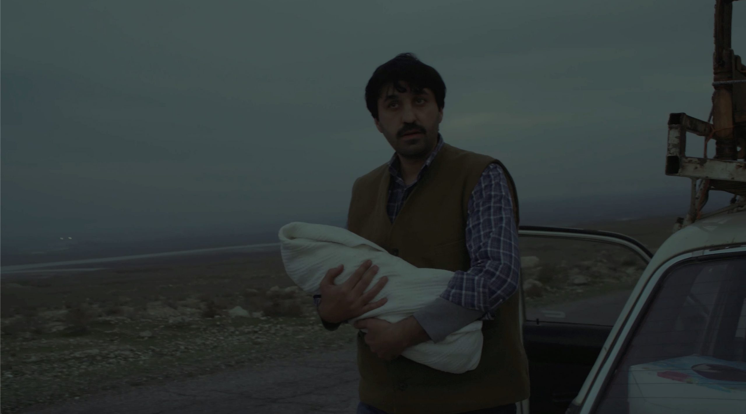 Мужчина с ребенком на руках, фильм "Обуза"